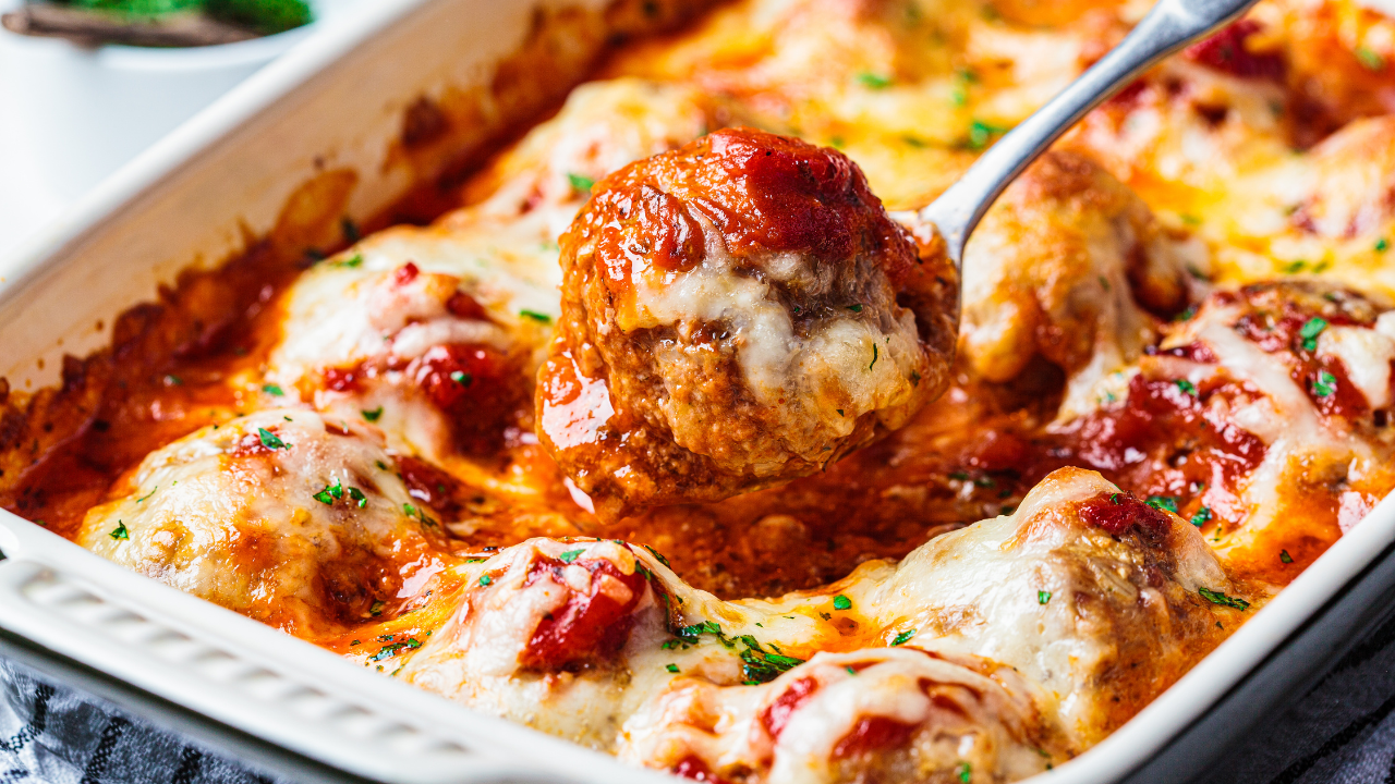 Baked cheesy meatballs Parmesan casserole with tomato sauce in the oven dish